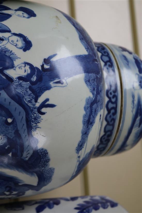 A pair of Chinese blue and white jars and cover and a pair of blue and white vases